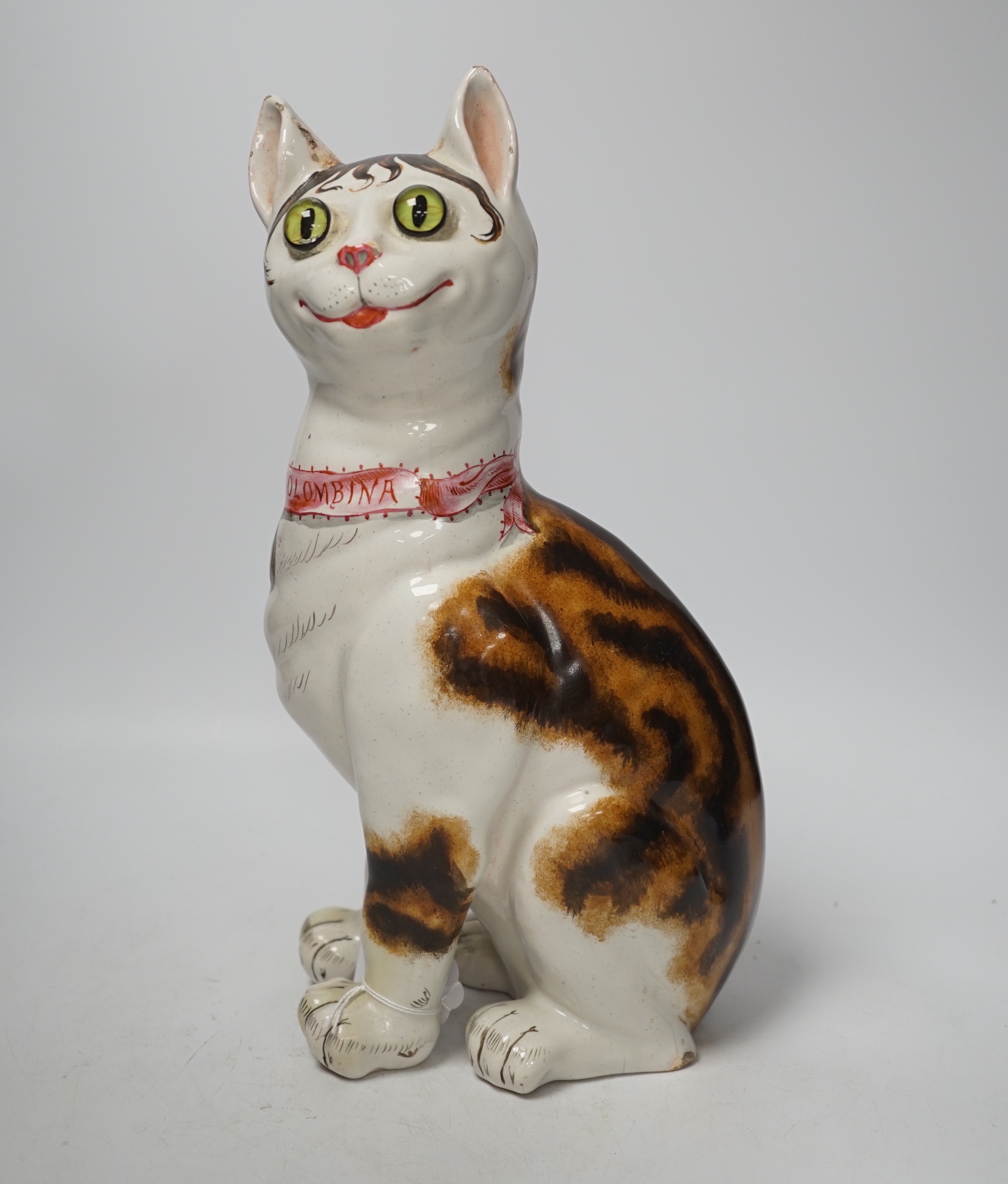 A Gallé faience cat ‘La Signara Colombina’ with glass eyes, signed Gallé Nancy to hind right foot, 32cm high